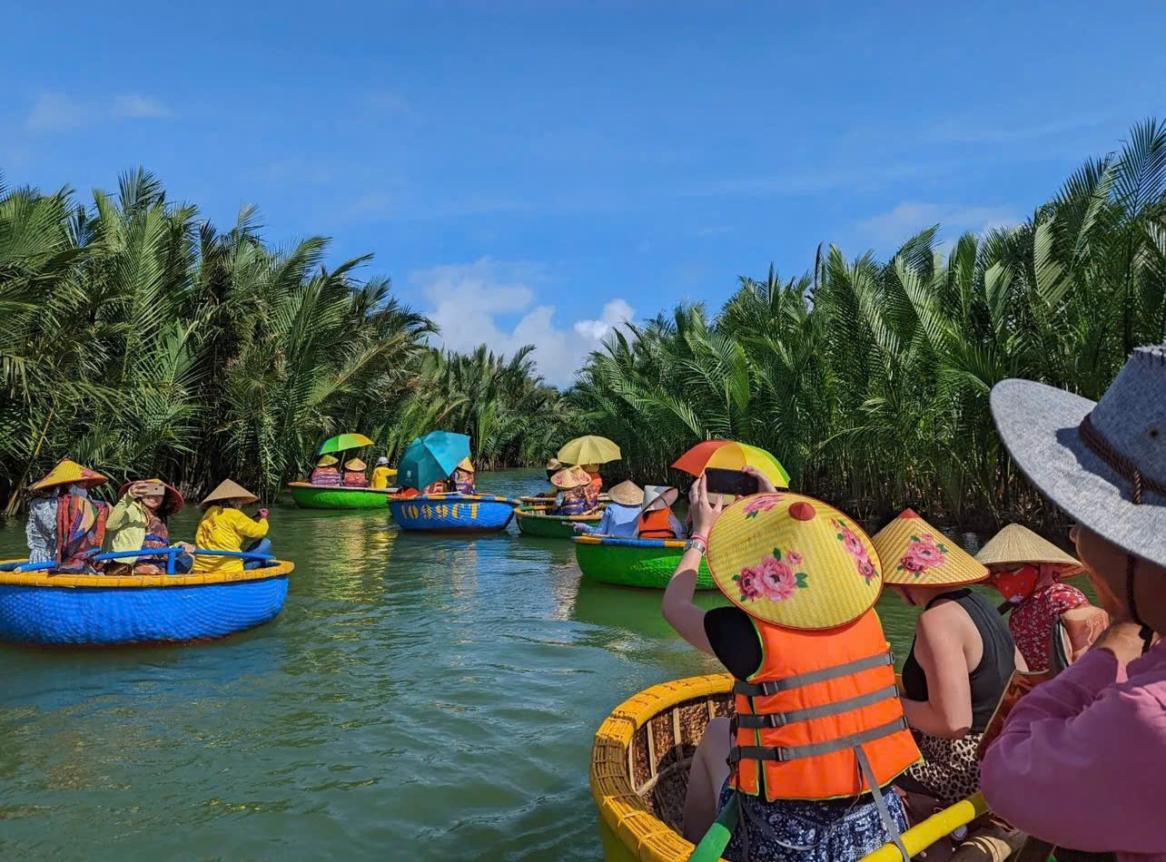 Tourists riding a basket boat in Hoi An Coconut Village